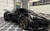 Black Corvette with paint protection film in a window tinting and PPF shop